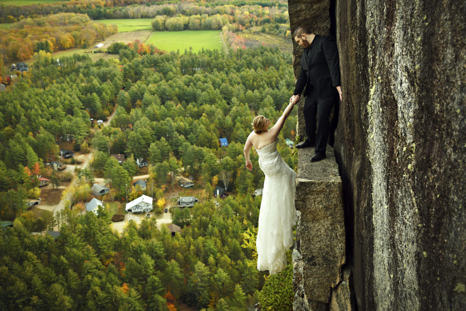 James and Melissa take a daring wedding photo. (Photo: Jay Philbrick/Caters News)