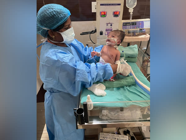 A nurse tending to the COVID-19 positive infant in Odisha's Bhubaneshwar (photo/ANI)