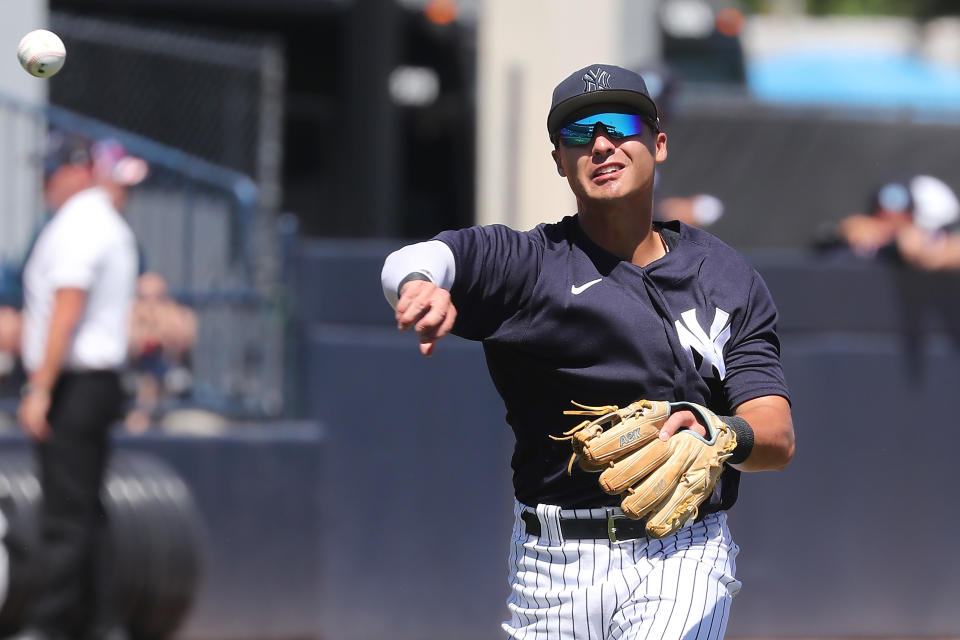 TAMPA, FL - MARCH 24: New York Yankees Infielder Anthony Volpe (77) throws the ball over to first base during the spring training game between the Minnesota Twins and the New York Yankees on March 24, 2023 at George M. Steinbrenner Field in Tampa, FL. (Photo by Cliff Welch/Icon Sportswire via Getty Images)