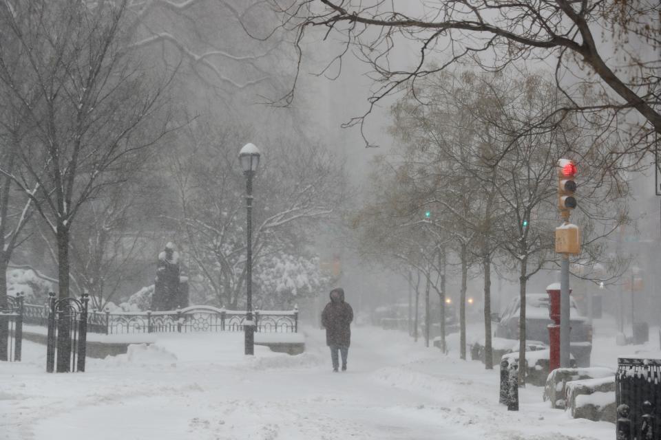 A woman walks through a snow-covered Union Square Park in New York City during a severe winter storm on Jan. 29.
