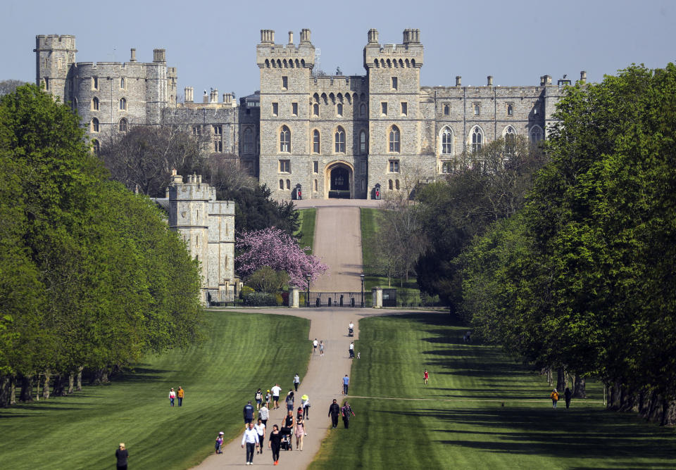 People on the Long Walk at Windsor Castle, Berkshire, during the Easter bank holiday weekend, as the UK continues in lockdown to help curb the spread of the coronavirus. (Photo by Steve Parsons/PA Images via Getty Images)