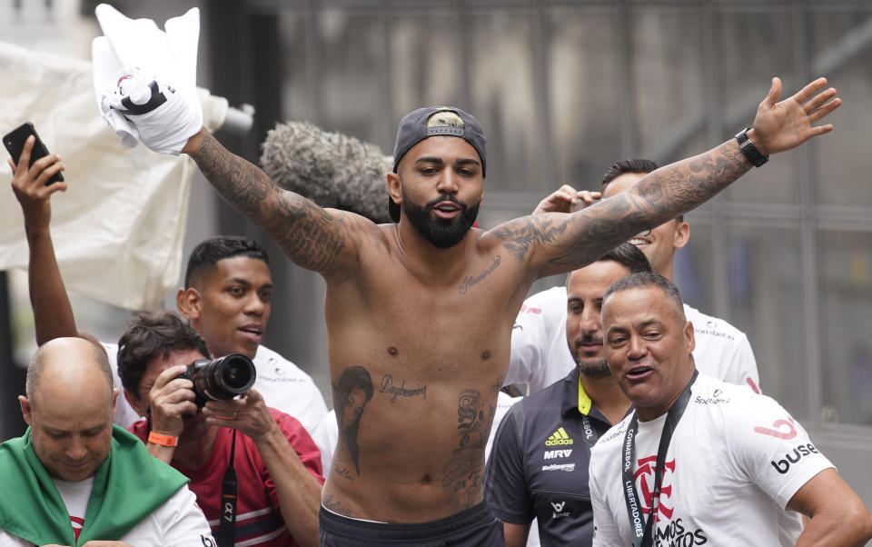 Gabriel of Brazil's Flamengo and teammates parade at their arrival in Rio de Janeiro, Brazil, Sunday, Nov. 24, 2019. Flamengo overcame Argentina's River Plate 2-1 in the Copa Libertadores final match on Saturday in Lima to win its second South American title. (AP Photo/Ricardo Borges)