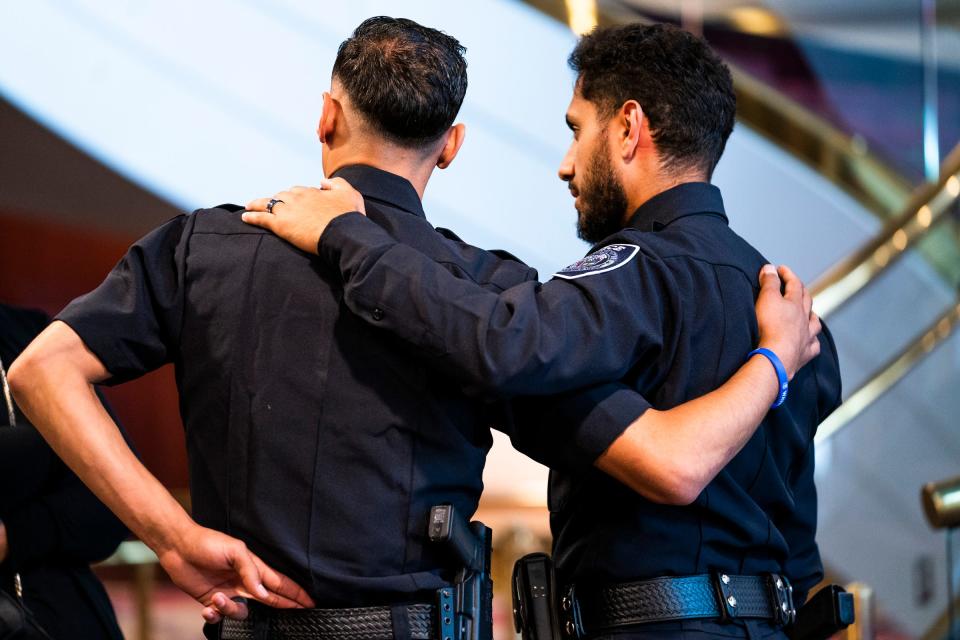 City of Wayne Police Officer Habas Kanan, left, embraces Melvindale Police Officer Ahed Ahmed during the visitation for their friend Mohamed Said, 23, a police officer for the Melvindale Police Department who was killed in the line of duty last Sunday. The visitation was held on Thursday, July 25, 2024 at the Ford Community and Performing Arts Center in Dearborn.