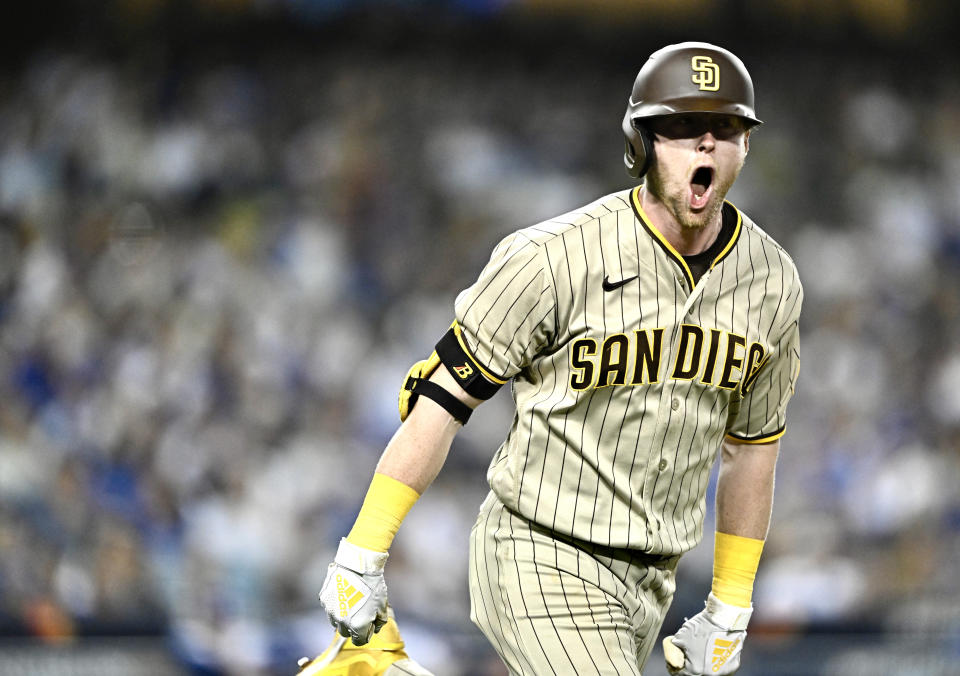 Los Angeles,  - October 12:  Jake Croneworth #9 of the San Diego Padres reacts after hitting a solo home run against the Los Angeles Dodgers in the eighth inning of Game 2 of a National League Division Series baseball game at Dodger Stadium in Los Angeles on Wednesday, October 12, 2022. (Photo by Keith Birmingham/MediaNews Group/Pasadena Star-News via Getty Images)