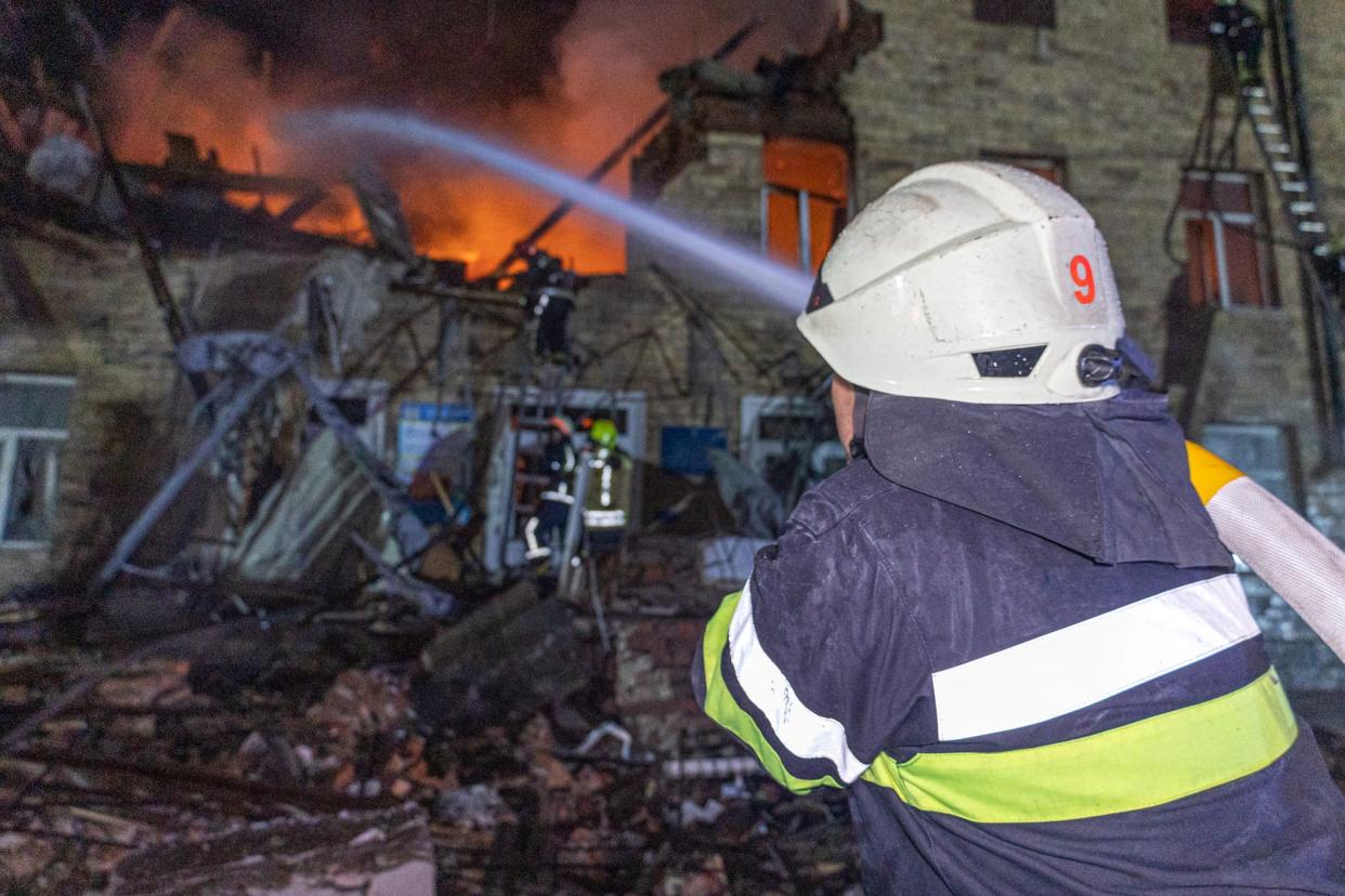 Rescuers work at a site of a building damaged by a Russian drone strike, amid Russia's attack on Ukraine, in Kharkiv, Ukraine, in this picture obtained from social media, released on August 1, 2023. (via REUTERS)