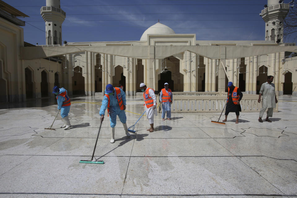 Volunteers disinfects a mosque ahead of the Muslim fasting month of Ramadan, in Peshawar, Pakistan, Friday, April 24, 2020. Muslims all around the world are trying to work out how to maintain the many cherished rituals of Islam's holiest month. (AP Photo/Muhammad Sajjad)