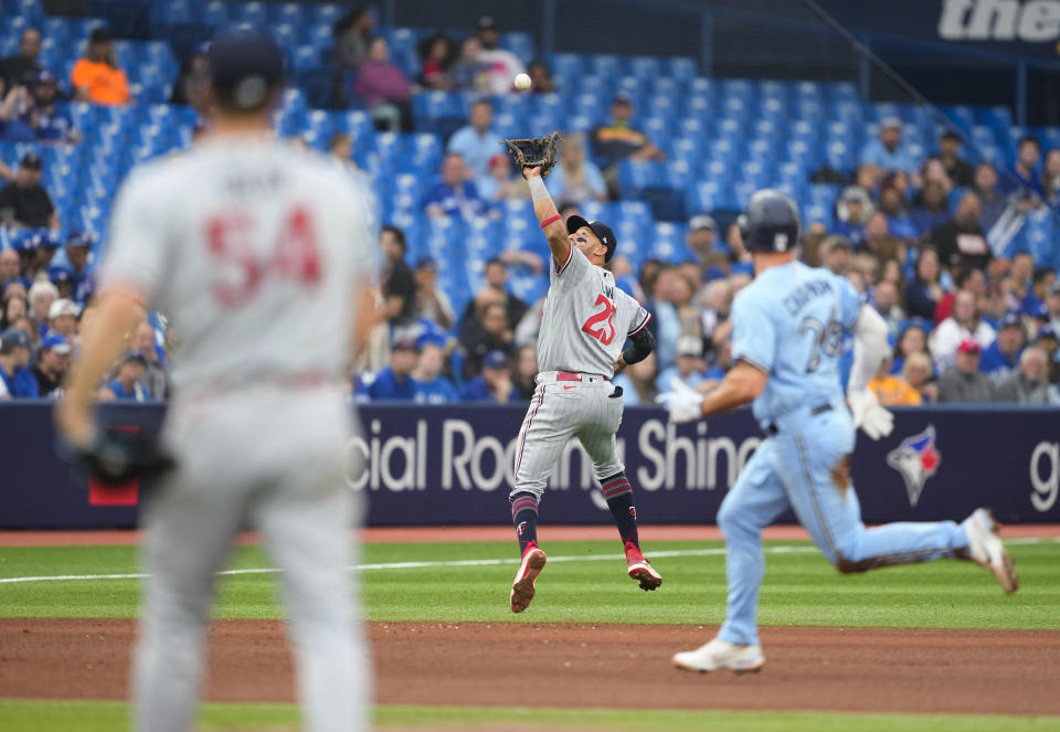 Minnesota Twins third baseman Royce Lewis (23) makes the catch on a ball hit by Toronto Blue Jays' Daulton Varsho during the fourth inning of a baseball game Friday, June 9, 2023, in Toronto. (Mark Blinch/The Canadian Press via AP)