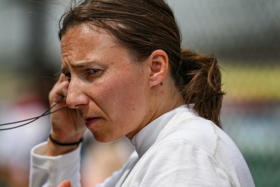 Paretta Autosport driver Simona De Silvestro (16) puts in her earpieces before a practice session Tuesday, May 18, 2021, in preparation for the Indy 500 at Indianapolis Motor Speedway.