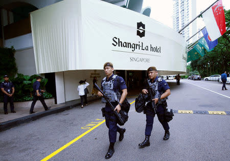 FILE PHOTO: Gurkhas patrol at the IISS Shangri-la Dialogue in Singapore June 1, 2018. REUTERS/Edgar Su/File Photo