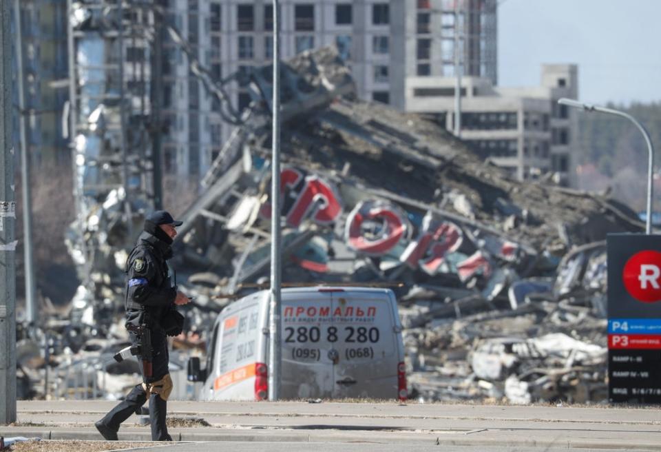 A damaged shopping centre in Kyiv is pictured on 21 March 2022. (EPA)