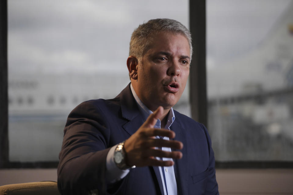 Colombia's President Ivan Duque speaks during an interview with The Associated Press before departing, to attend the United Nations General Assembly, from the CATAM air base in Bogota, Colombia, Saturday, Sept. 21, 2019. Duque's will speak before the General Assembly and is expected to condemn Venezuelan leader Nicolás Maduro as an abusive autocrat who is not only responsible for the country's humanitarian catastrophe but is also now a threat to regional stability for his alleged harboring of Colombian rebels labeled a terrorist group by the U.S. and European Union. (AP Photo/Ivan Valencia)