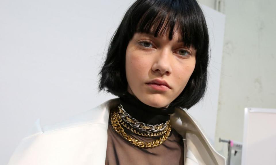 Chunky gold chains in the Sacai show for Paris Fashion Week.