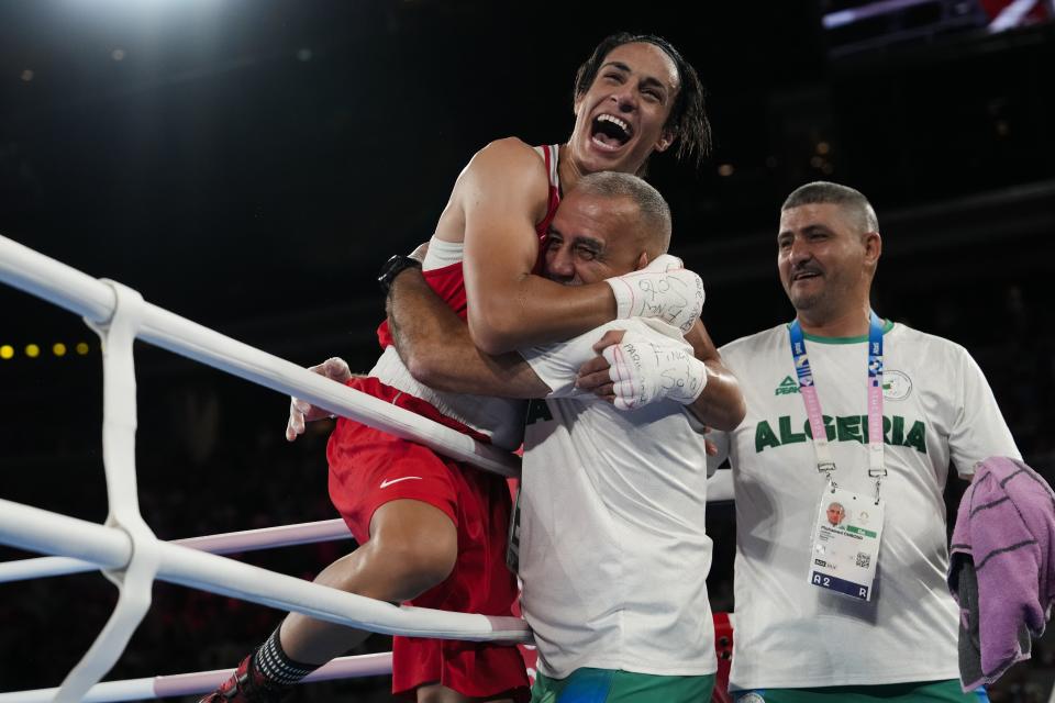 Algeria's Imane Khelif celebrates after defeating China's Yang Liu to win gold in their women's 66 kg final boxing match at the 2024 Summer Olympics, Friday, Aug. 9, 2024, in Paris, France. (AP Photo/Ariana Cubillos)