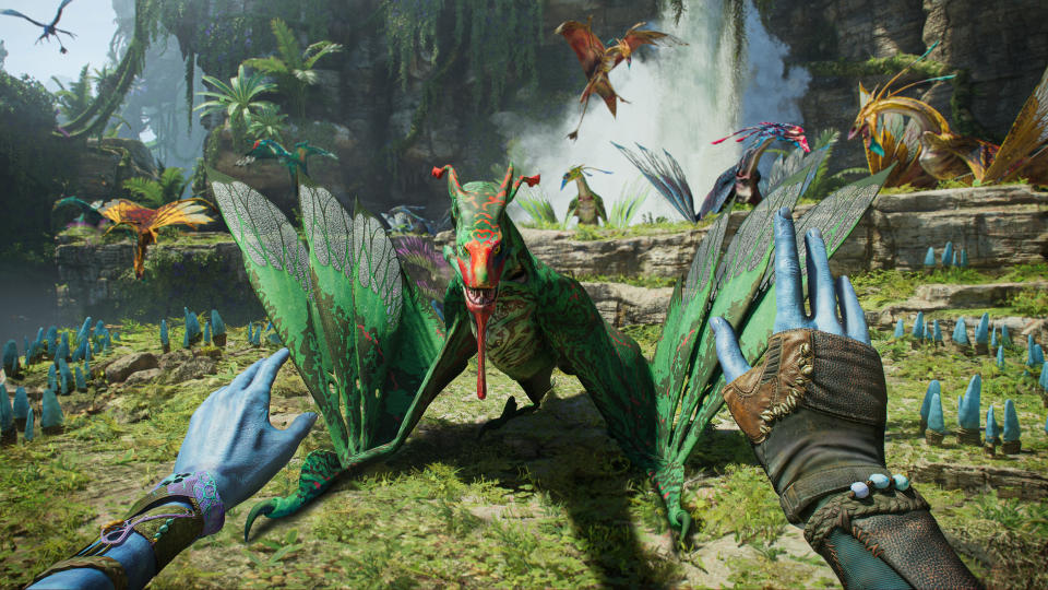 The na'vi player character soothes an ikran flying beast in Avatar: Frontiers of Pandora.