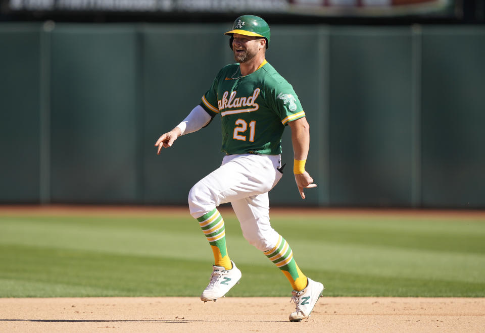 OAKLAND, CALIFORNIA - OCTOBER 05: Stephen Vogt #21 of the Oakland Athletics celebrates while trotting around the bases after hitting a solo home run against the Los Angeles Angels in the bottom of the seventh inning of the game at RingCentral Coliseum on October 05, 2022 in Oakland, California.  (Photo by Thearon W. Henderson/Getty Images)