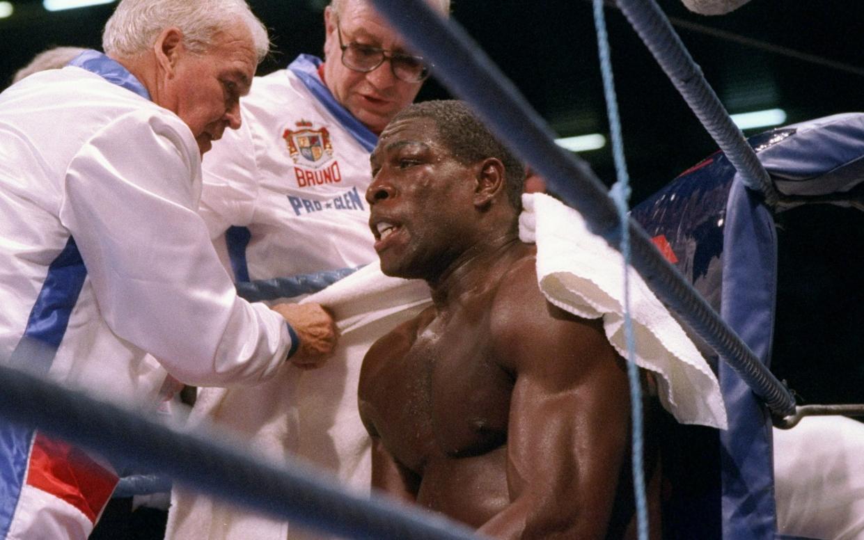 Frank Bruno looks on from his corner between rounds of a bout between Lennox Lewis and Frank Bruno in Cardiff, Wales.