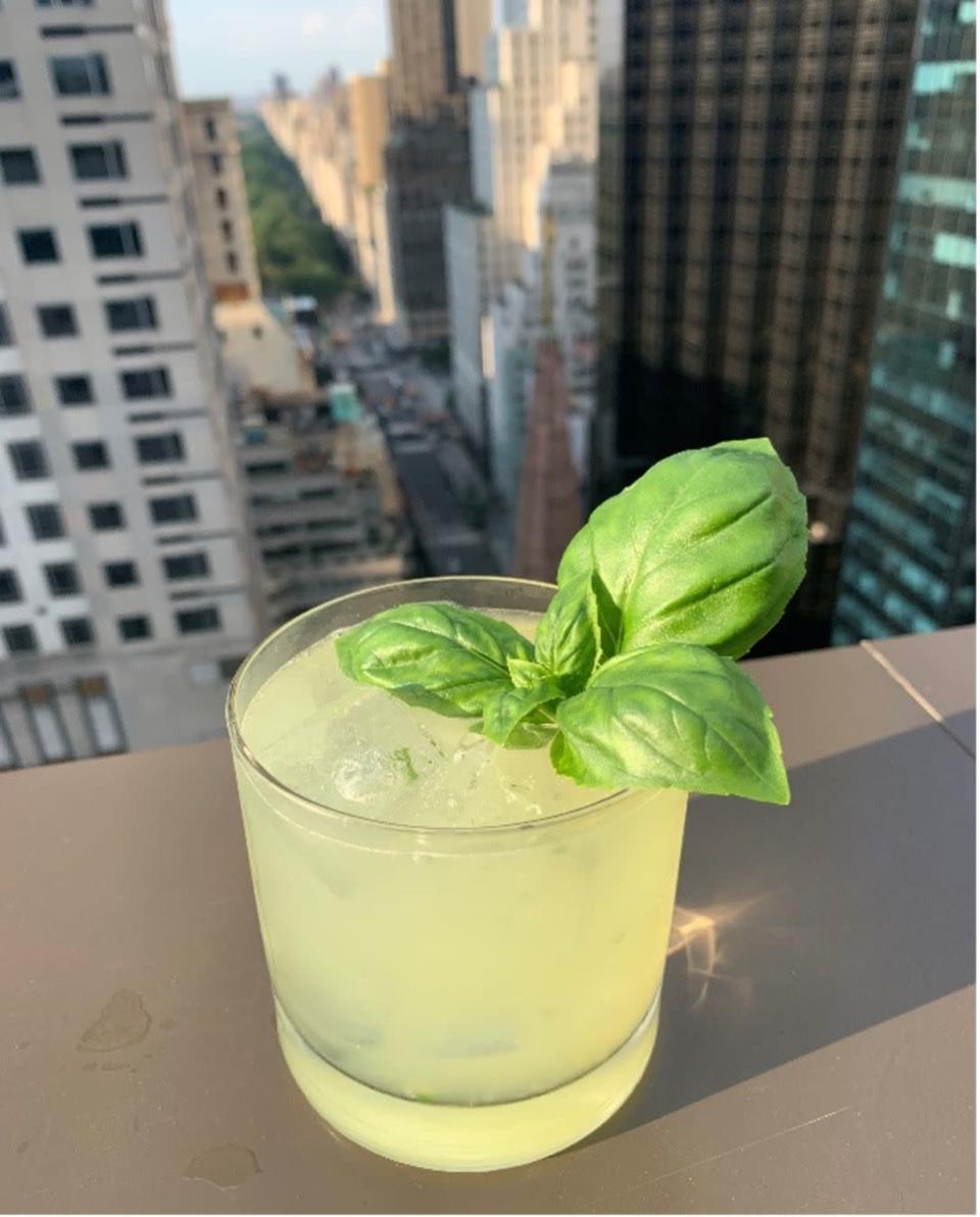 <p>New York City is back, and Salon de Ning, <a href="https://www.peninsula.com/en/new-york/5-star-luxury-hotel-midtown-nyc" rel="nofollow noopener" target="_blank" data-ylk="slk:The Peninsula New York's" class="link ">The Peninsula New York's</a> iconic rooftop bar, is currently featuring an exclusive, off-the-menu cocktail made with fresh basil from the hotel garden. </p><p><strong>Ingredients:</strong> </p><ul><li>3 cucumber slices</li><li>1 sprig fresh basil</li><li>2 ounces tequila</li><li>¼ tablespoon simple syrup</li><li>1/4 fresh lime </li></ul><p><strong>Steps:</strong></p><ol><li>Muddle cucumber and basil in a cocktail shaker. </li><li>Add tequila, simple syrup, and lime. </li><li>Shake and pour in a rocks glass on ice. </li><li>Garnish with an extra sprig of basil.<br></li></ol>