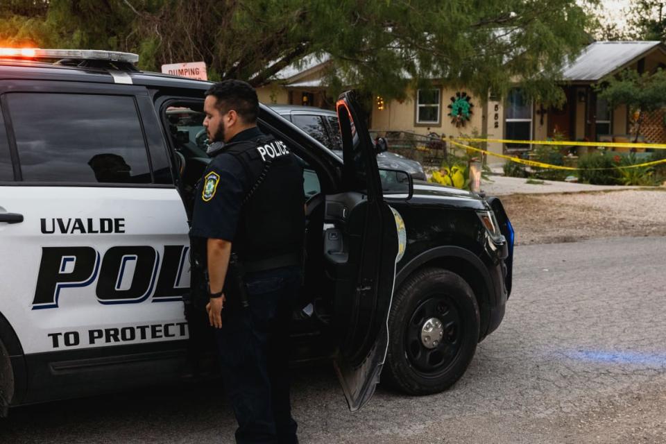 <div class="inline-image__caption"> <p>Uvalde Police gather outside the home of suspected gunman 18-year-old Salvador Ramos in Uvalde, Texas.</p> </div> <div class="inline-image__credit"> Jordan Vonderhaar </div>