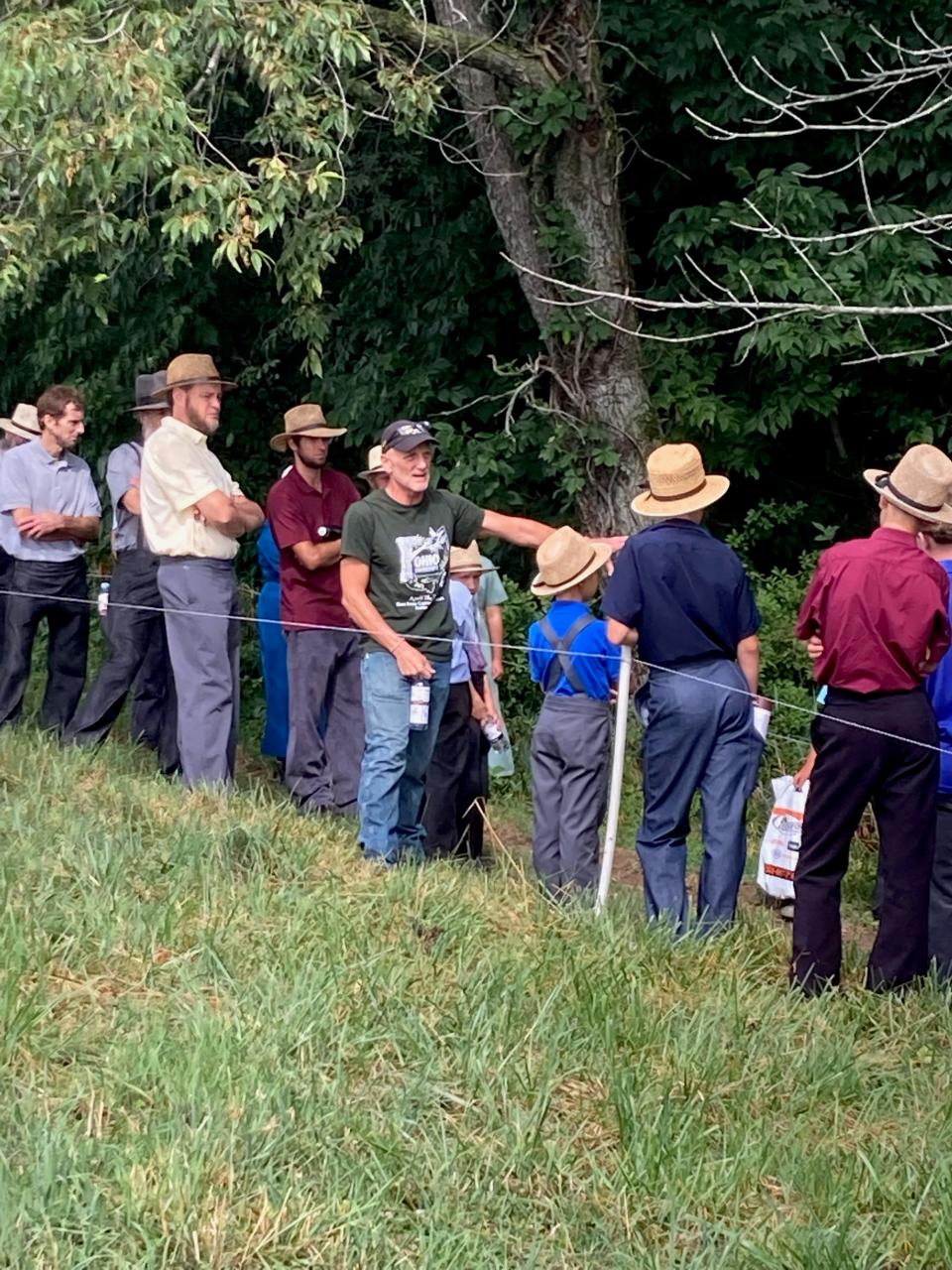 John Lorson (center) stops along the edge of the pasture and woods to point something out during his nature walk talk at Family Farm Field Days in Baltic.