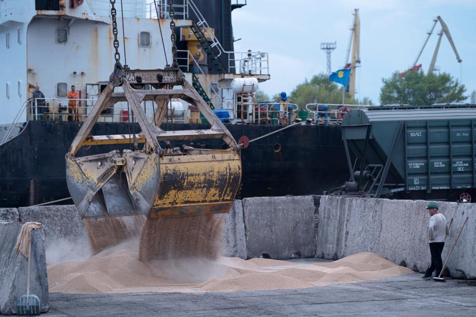 Workers load grain at a grain port in Izmail, Ukraine, on April 26, 2023. (Copyright 2023 The Associated Press. All rights reserved)
