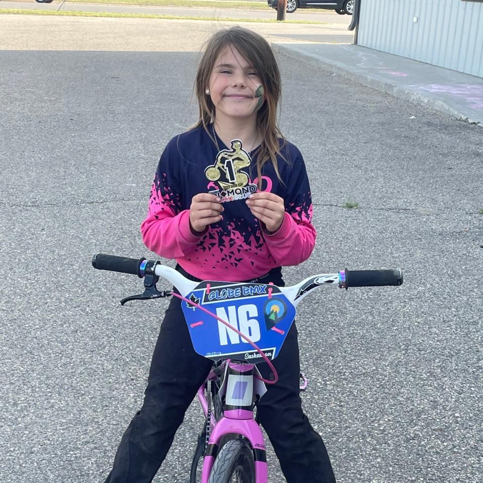 Ariel Kelly, a 9-year-old BMX rider who plans to represent Canada in the UCI BMX World Championships. The championship is in May 2024.