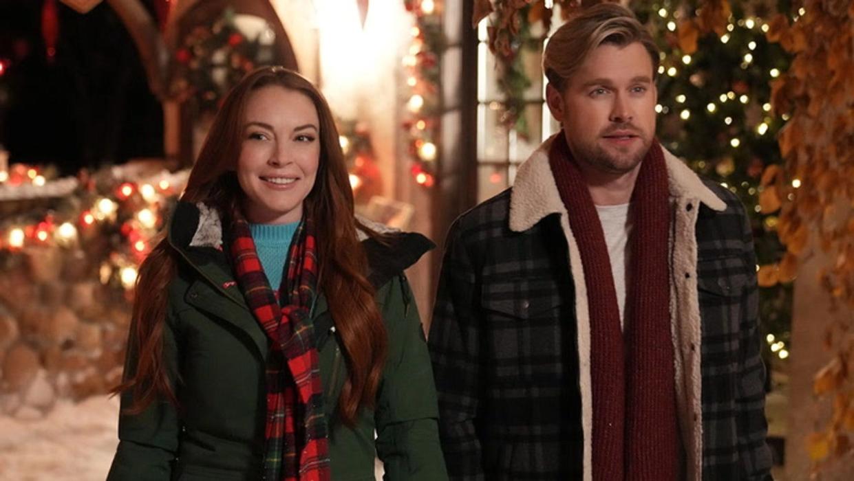 Lindsay Lohan and Chord Overstreet walking with coats on