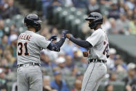 Detroit Tigers' Brendon Davis is greeted at home by Riley Greene after he scored against the Seattle Mariners during the fifth inning of a baseball game, Wednesday, Oct. 5, 2022, in Seattle. (AP Photo/John Froschauer)