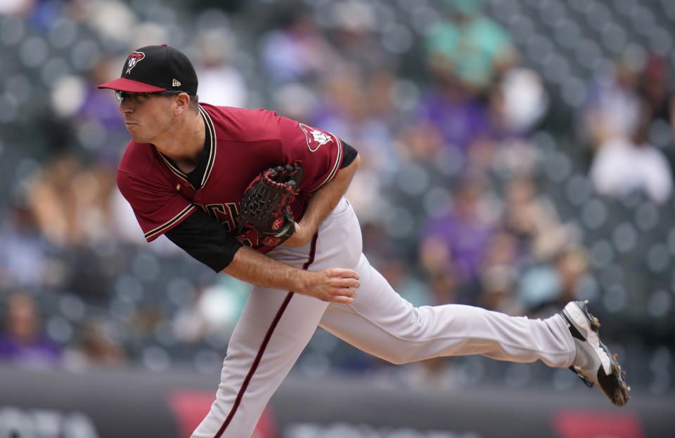 Arizona Diamondbacks starting pitcher Taylor Widener in the first inning of a baseball game Sunday, May 23, 2021, in Denver. (AP Photo/David Zalubowski)