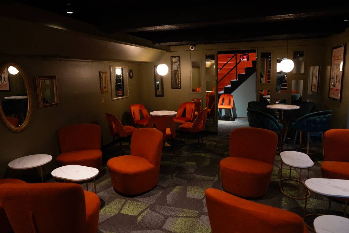 The basement area of the new Oliver’s Lounge in Lincoln Heights Village features mid century-style rust-colored furnishings.