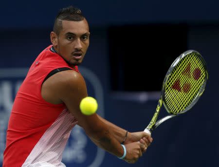 Nick Kyrgios of Australia returns the ball to Stanislas Wawrinka of Switzerland during their semi final match at the ATP Dubai Duty Free Tennis Championships, February 26, 2016. REUTERS/Ahmed Jadallah