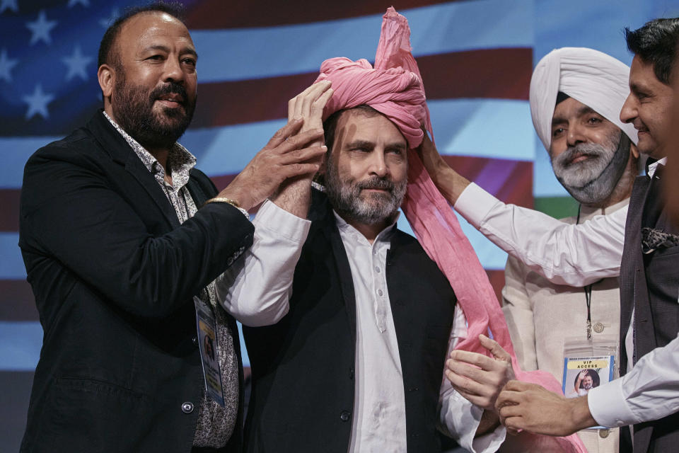 Indian politician Rahul Gandhi, center, is welcomed as he arrives at the Javits Center, Sunday, June 4, 2023, in New York. (AP Photo/Andres Kudacki)