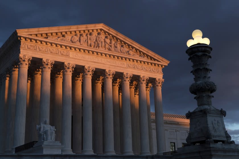 FILE - In this Jan. 24, 2019 file photo, the Supreme Court is seen at sunset in Washington. The Supreme Court has ruled that insurance companies can collect $12 billion from the federal government to cover their losses in the early years of the health care law championed by President Barack Obama. The justices voted 8-1 Monday in holding that insurers are entitled to the money under a provision of the "Obamacare" health law that promised the companies a financial cushion for losses they might incur by selling coverage to people in the marketplaces created by the health care law. (AP Photo/J. Scott Applewhite)