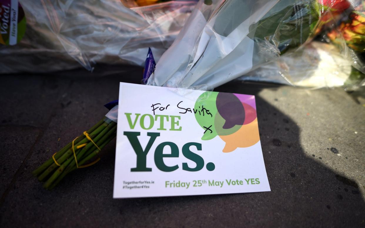 Messages are left at the foot of a mural of Savita Halappanavar put up on the day of the Abortion Referendum on liberalising abortion laws in Dublin - REUTERS