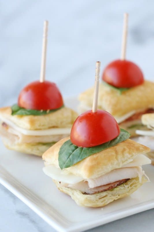 <p>Glorious Treats</p><p>Puff pastry makes the perfect base for these quick and easy hands friendly sliders.</p><p><strong>Get the recipe: <a href="https://www.glorioustreats.com/turkey-pesto-appetizer-bites/" rel="nofollow noopener" target="_blank" data-ylk="slk:Turkey Pesto Appetizer Bites;elm:context_link;itc:0;sec:content-canvas" class="link ">Turkey Pesto Appetizer Bites</a></strong></p>