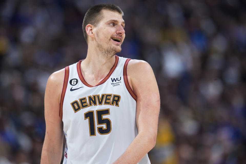 Denver Nuggets center Nikola Jokic looks to the bench during the second half of Game 5 of the team's NBA Western Conference basketball semifinal playoff series against the Phoenix Suns on Tuesday, May 9, 2023, in Denver. (AP Photo/David Zalubowski)