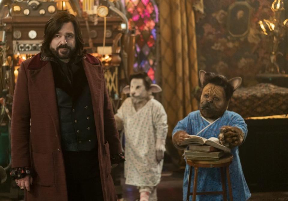 “WHAT WE DO IN THE SHADOWS” -- “Hybrid Creatures” --  Season 5, Episode 7 (Airs August 17) — Pictured (L-R):  Matt Berry as Laszlo, Raeanna Guitard as Dog-Guillermo.  CR: Russ Martin/FX