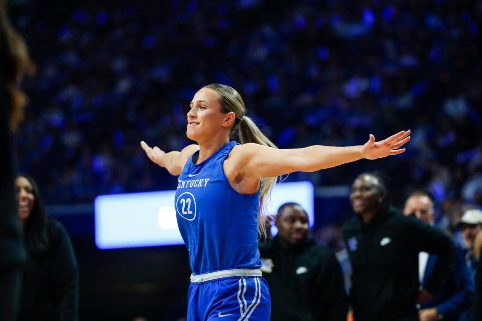 Maddie Scherr, Kentucky’s returning leader in points, rebounds and assists from last season, flexes after winning the three-point shooting contest during Big Blue Madness in Rupp Arena on Friday night.