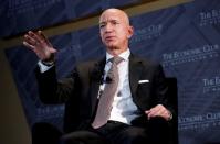 FILE PHOTO: Jeff Bezos, president and CEO of Amazon and owner of The Washington Post, speaks at the Economic Club of Washington DC's "Milestone Celebration Dinner" in Washington