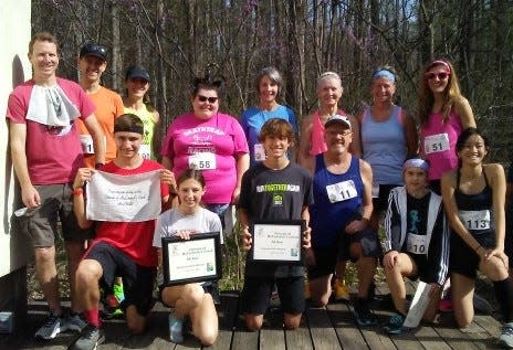 Overall and age group winners for the run include, front row, from left, Tre’ Bower, Maddie Graber, Caleb Winders, Ray Byrne, Becca Patterson and Lila Pierce. Back row: Justin Graham, Kyle Massey, Cheryl Massey, Izzy Hooper, Mel Howard, Joanne Allee, Staci Fiddler and Kathy Hammel.