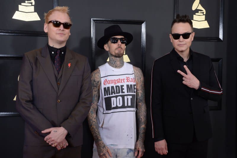 Left to right, Mark Hoppus, Travis Barker and Matt Skiba of Blink-182 arrive for the 59th annual Grammy Awards held at Staples Center in Los Angeles in 2017. File Photo by Jim Ruymen/UPI