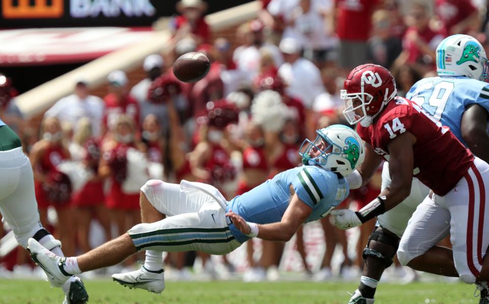 Oklahoma's Reggie Grimes causes a fumble during last season's opener against Tulane.