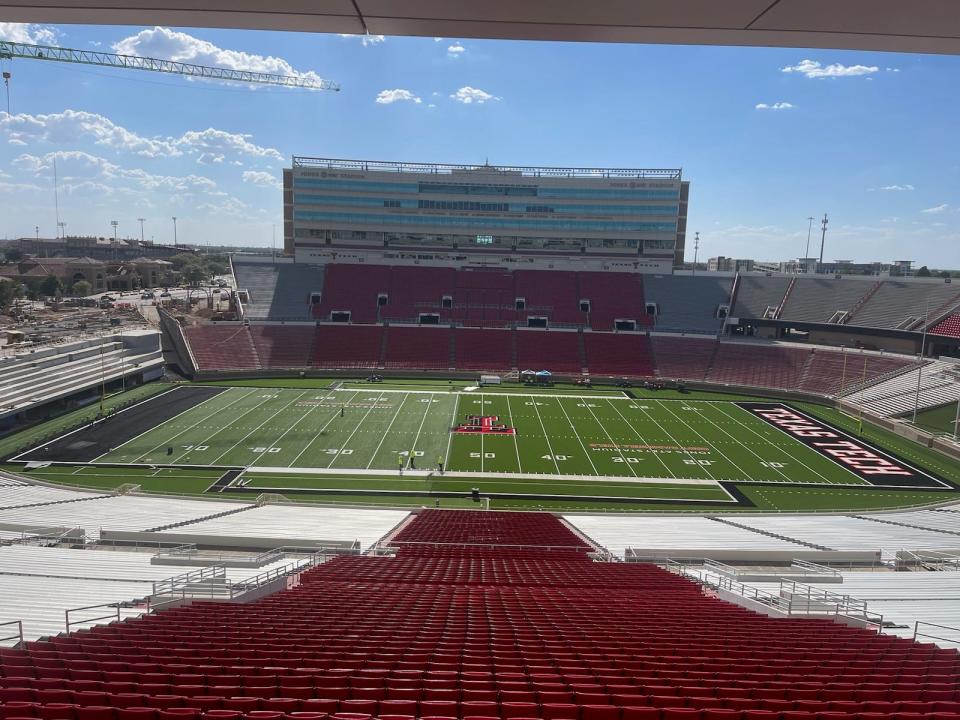 A view of Jones AT&T Stadium on Friday afternoon shows the progress of the ongoing turf installation. Later Friday, lettering was placed in the south end zone. Infill material from the south end 45-yard line to the end of the field was still to be added.