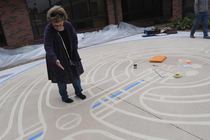 Annelle Brown Tanner, a Veriditas-trained advanced labyrinth facilitator, points to where the heart space will be in the labyrinth being built at the Rapides Cancer Center at Rapides Regional Medical Center.