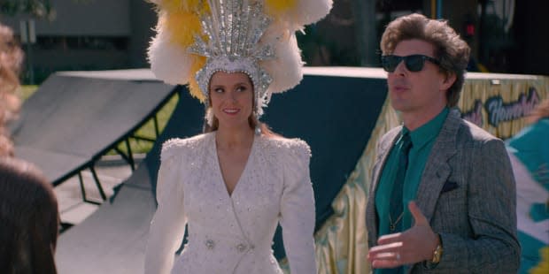 Rhonda in a 'Jubilee!' headdress and Bash (Chris Lowell). <em>Photo: Courtesy of Netflix</em>