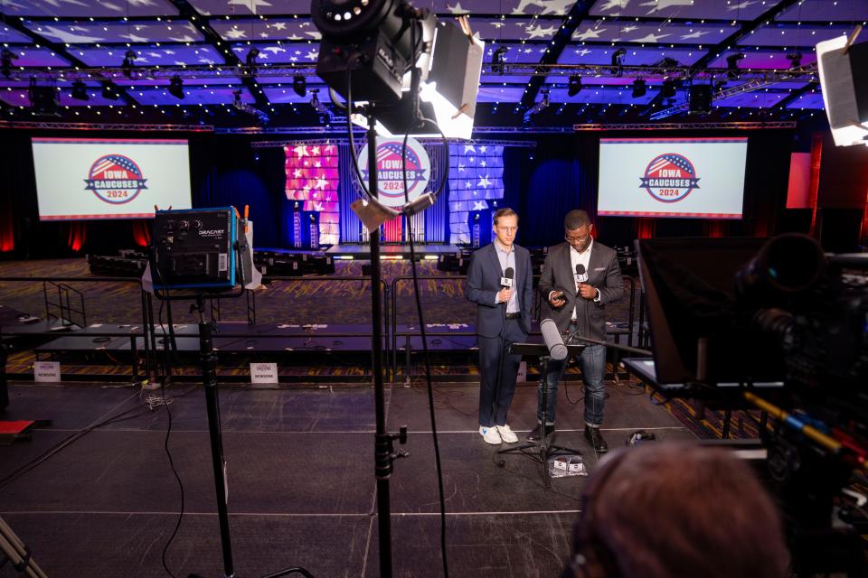 Galen Druke and Alex Presha of ABC News prepare for a standup at the media filing center in the Iowa Events Center, Friday, Jan. 12, 2024.