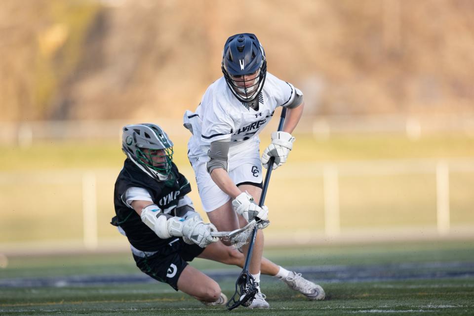 Corner Canyon’s Benjamin Brand (3) battles Olympus’ Weston Holtby (2) for the ball during a high school boys lacrosse game at Corner Canyon High School in Draper on April 14, 2023. | Ryan Sun, Deseret News