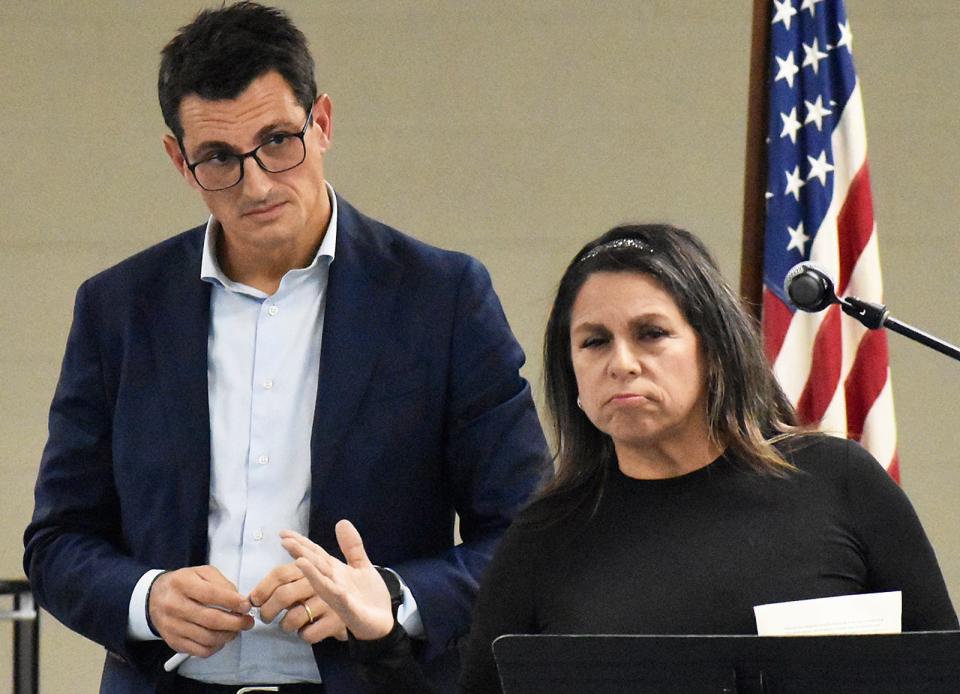 Alberto Boffelli of Prysmian listens as Somerset resident Nancy Thomas speaks before the Somerset zoning board at North Elementary school in Somerset Thursday Oct. 26, 2023.