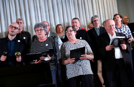 Members of the "Breathing for the Soul" choir, who are patients suffering from lung diseases, sing during their concert in Budapest, Hungary, November 15, 2018. Picture taken November 15, 2018. REUTERS/Bernadett Szabo