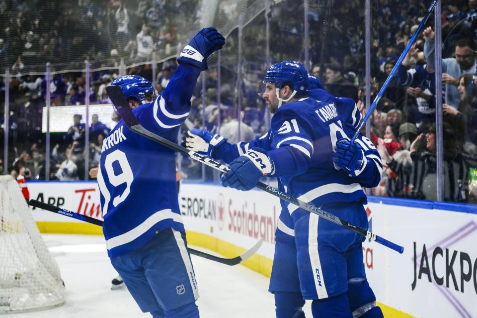 Toronto Maple Leafs center John Tavares (91) celebrates with teammates after scoring during the second period of an NHL hockey game against the Detroit Red Wings, Saturday, Jan. 7, 2023 in Toronto. (Christopher Katsarov/The Canadian Press via AP)