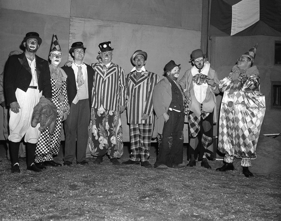 <p>Seven of these eight costumed clowns are radio and television personalities, while the eighth (third from right) is Otto Griebling, who earns his livelihood as a clown with Ringling Brothers and Barnum and Bailey Circus. Group gathered at New York’s Madison Square Garden, April 1, 1953 for opening performance of “The Greatest Show On Earth.” From left are: Al Schacht, perennial baseball clown; Garry Moore, Sid Caesar, Lauritz Melchior, Jack Carter, Otto Griebling, Herb Shriner and Sam Levenson. The radio and TV personalities participated in the opening night performance with proceeds going to United Cerebral Palsy of New York. (AP Photo/Matty Zimmerman) </p>